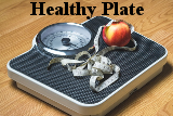 Scale, with tape measure, and an apple. Healthy Plate.